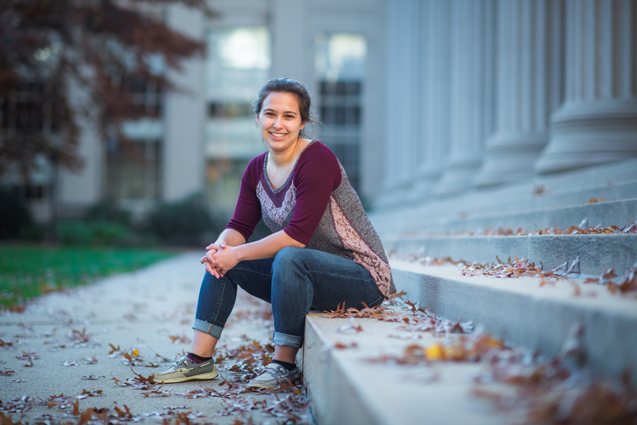 Nina Levine sitting on outdoor steps of MIT building