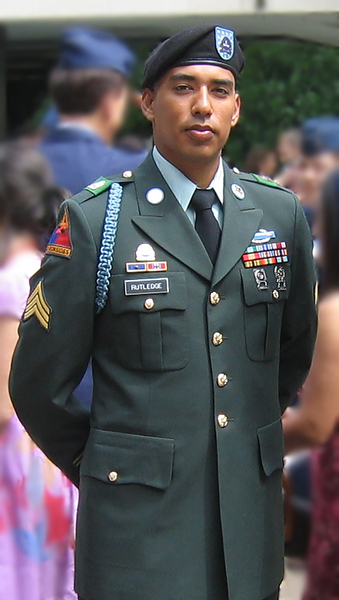 Omar Rutledge standing at ease in a U.S. Army dress uniform