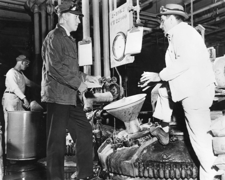 Black-and-white photo of William Dalzell working at a refinery