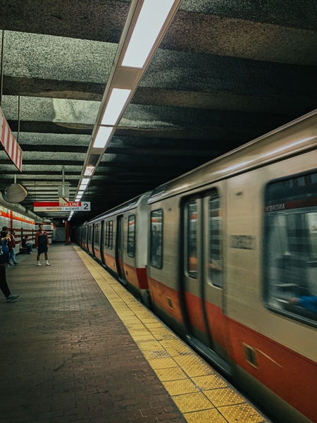 Photo of a Red Line MBTA subway train arriving at an underground station