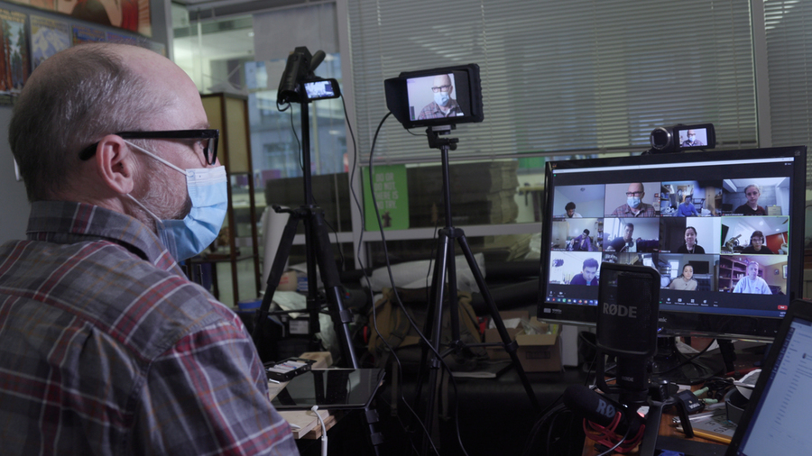 Photo of Danny Braunstein in front of his computer, leading a Zoom virtual lab session