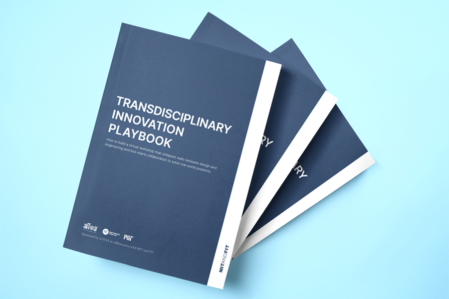Illustration of a stack of blue books; the one on top has a title of "Transdisciplinary Innovation Playbook"