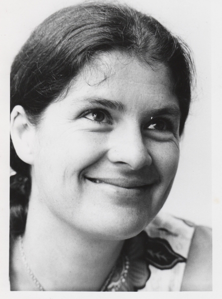 A black-and-white headshot of a smiling Mary Rowe