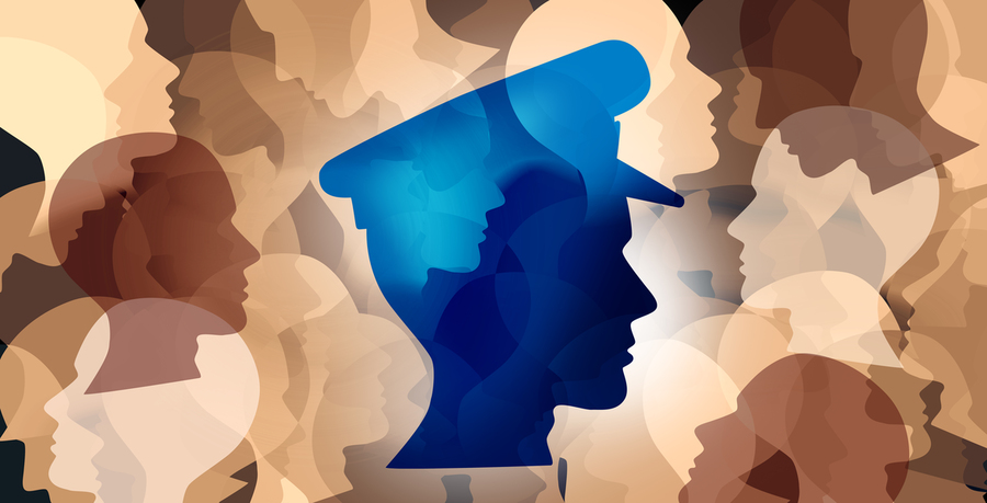 Stylized image of brown and white head silhouettes with a blue one in a police hat front and center