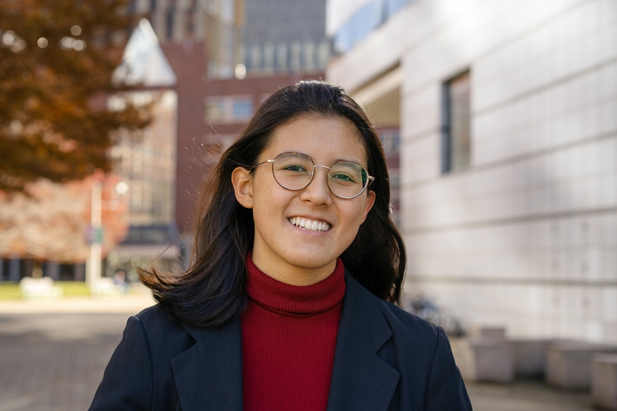 Headshot of Laura Rosado with the MIT campus in the background