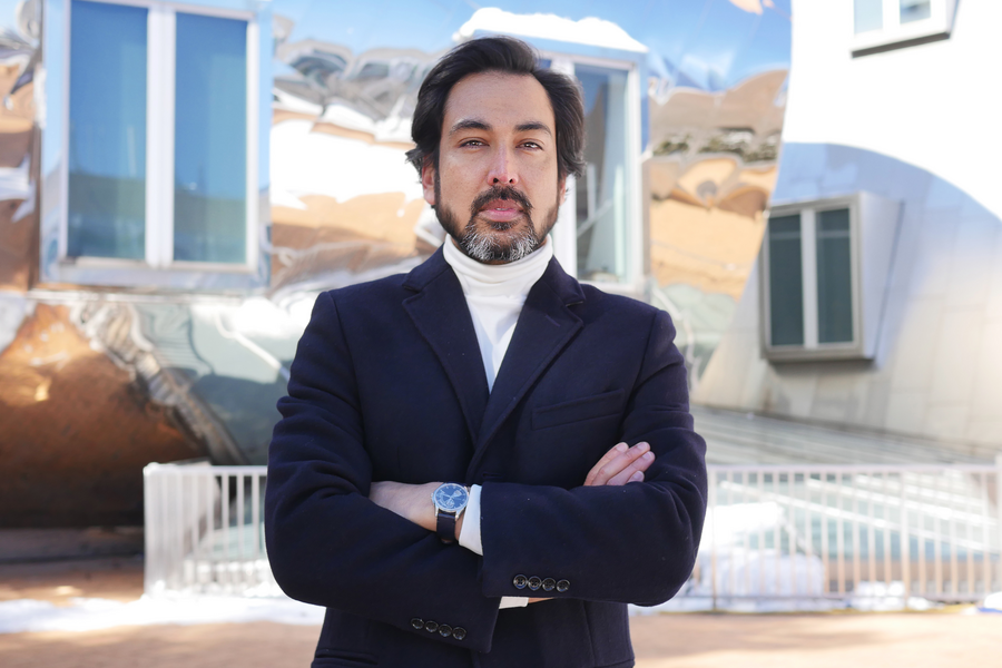 Portrait photo of Dig Bijay Mahat, standing with his arms crossed