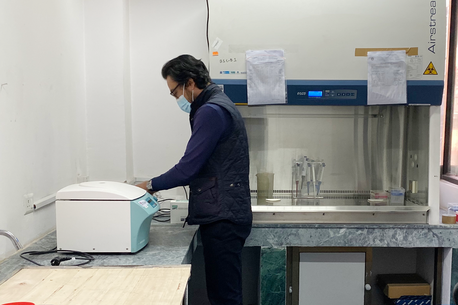 Photo of Dig Bijay Mahat in a small lab space