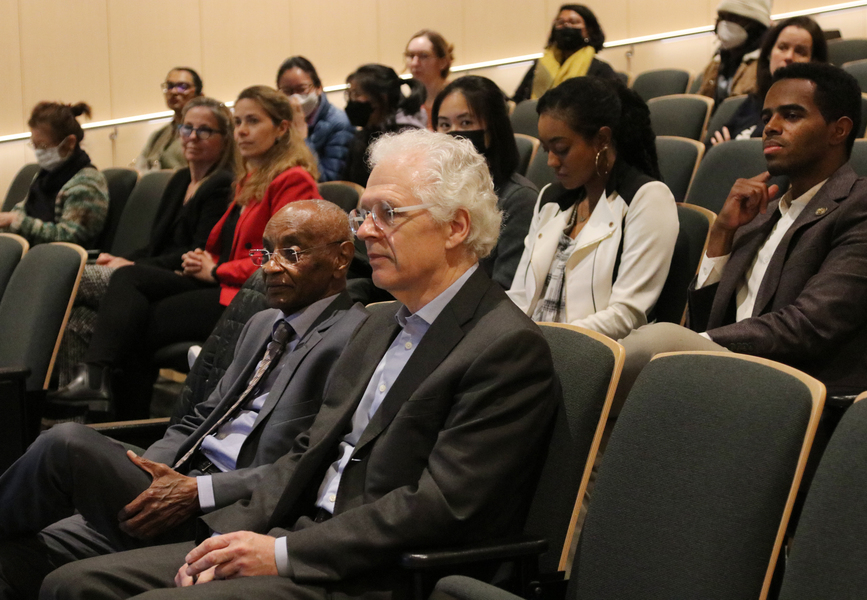 Photo of audience members in an auditorium