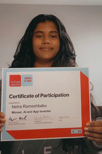 Portrait photo of female teenager holding a certificate of participation