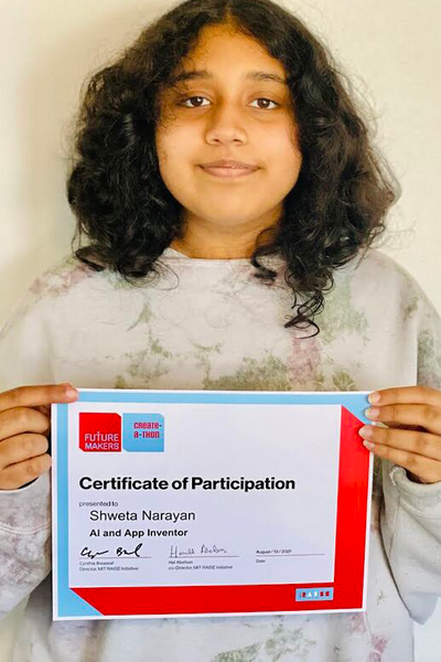 Portrait photo of female teenager holding a certificate of participation