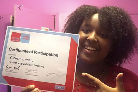 Head and shoulders of female teenager holding a certificate of participation