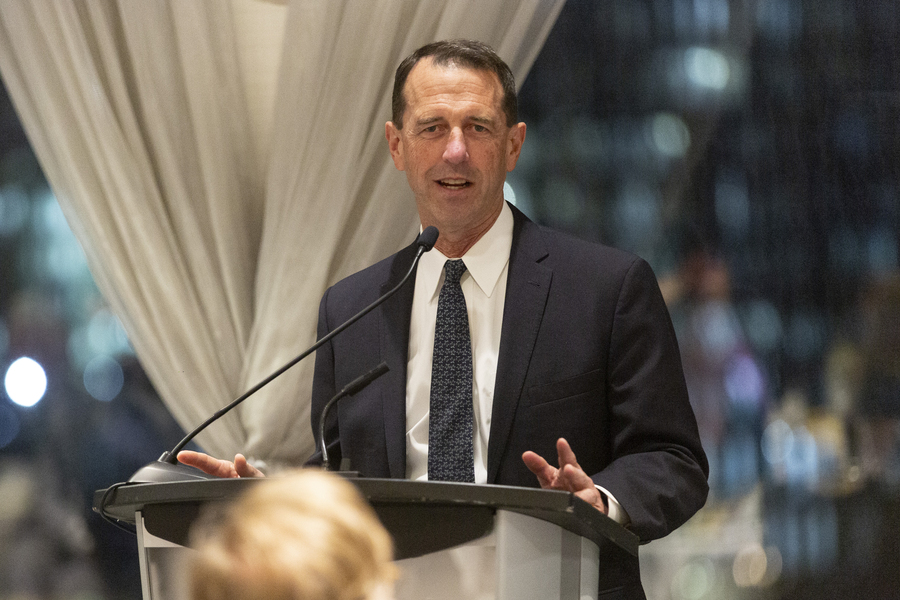 Photo of John Richardson speaking at a podium