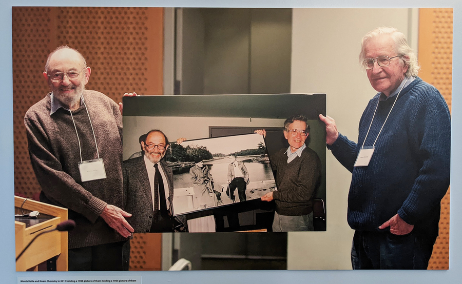 Photo of a photo of Morris Halle and Noam Chomsky, holding a photograph of themselves holding a photograph from earlier years, holding another photo of themselves from even earlier