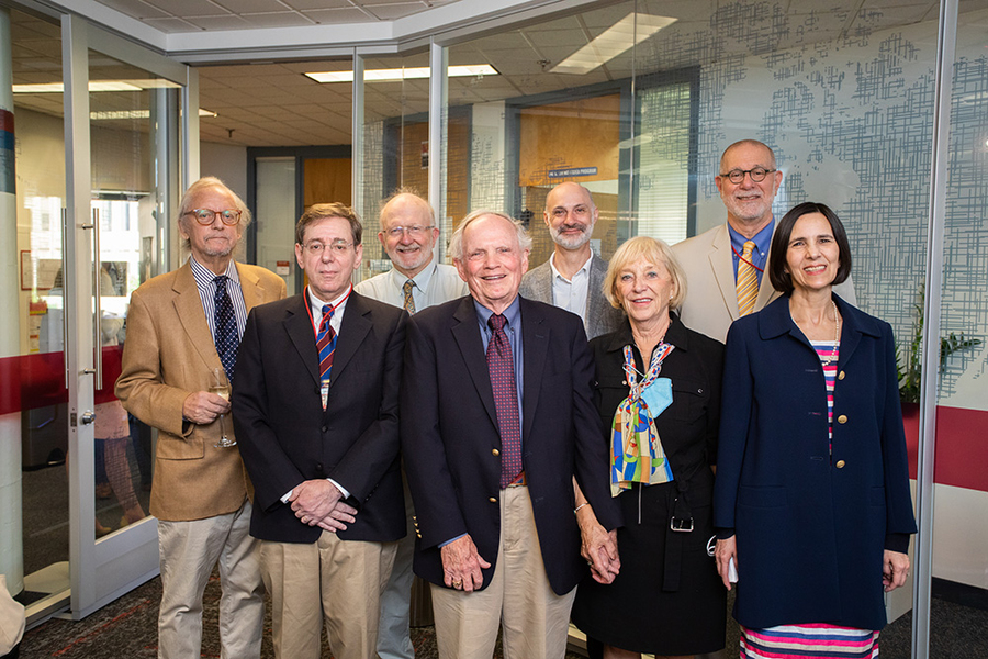 Photo of seven guests posing with Robert Wilhelm in the new conference room
