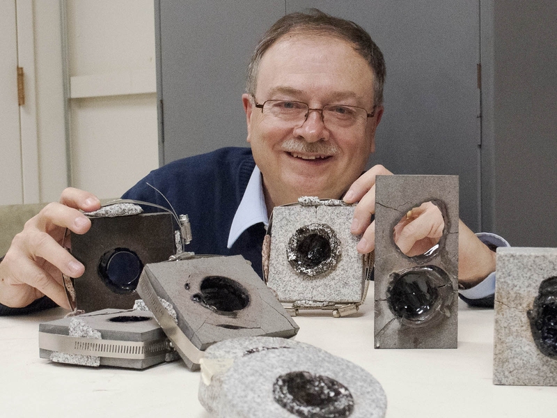 Paul Woskov with blasted rock samples