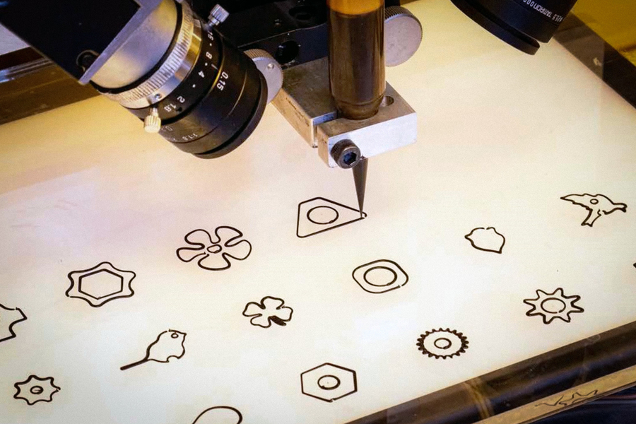 a 3-d printer extrudes shapes