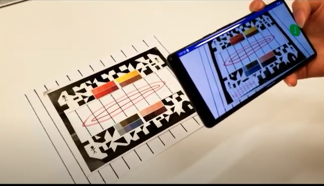 Mobile phone takes photo of paper picture frame