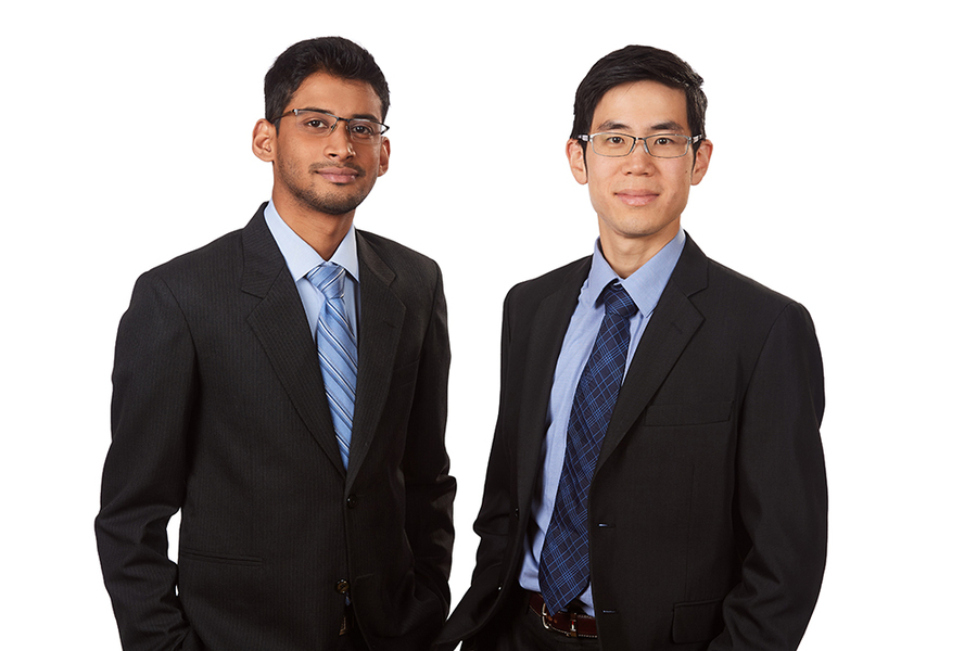 Photo of Vidyut Mohan and Kevin Kung standing side-by-side before a white background