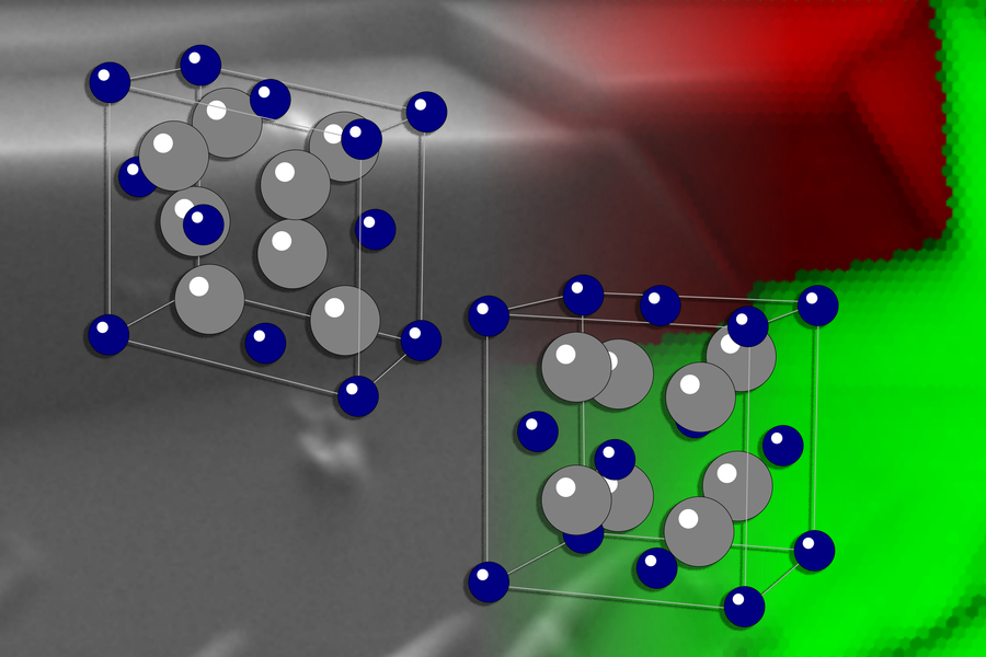 2 illustrated transparent boxes have blue balls on the edges and corners, and blue and gray balls inside. The background is gray with pixelated red and green swaths on the right side.