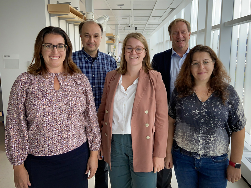 Five MIT.nano staff and members of the UpNano team pose standing in a hallway.