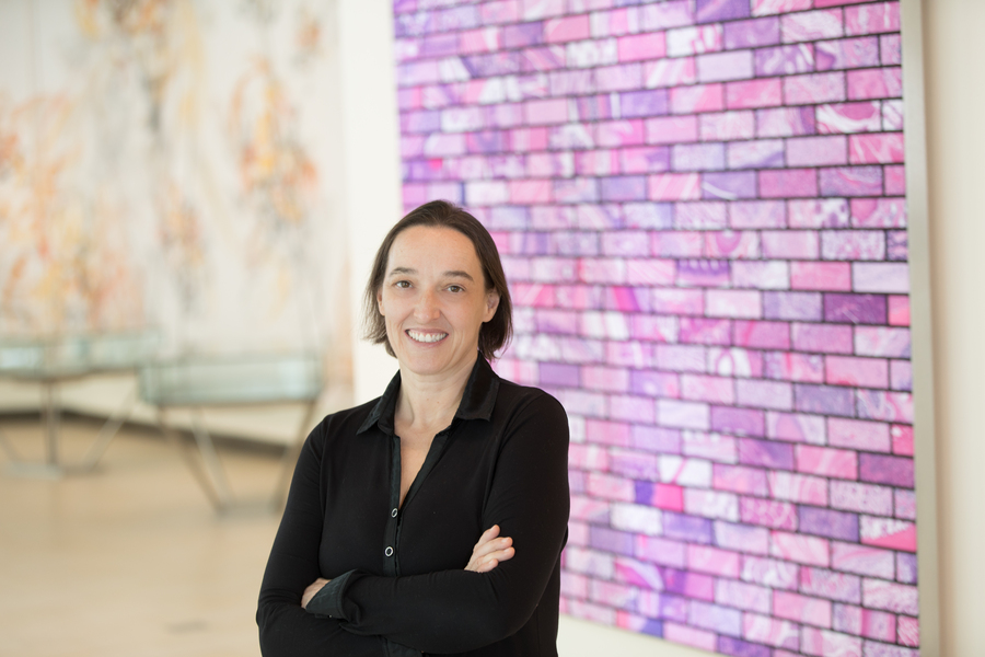 Photo of Angelika Amon standing with her arms crossed