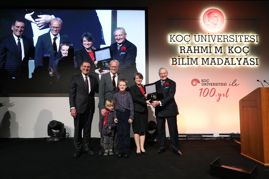 Bilge Yildiz stands with her family onstage as she receives the Rahmi M. Koç Medal of Science.