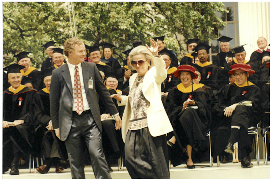 Mary Morrissey and Martin Schlecht on the Commencement stage, with members of the MIT Corporation seen in the background