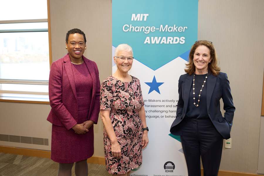 Melissa Nobles, Maryanne Kirkbride, and Cynthia Barnhart stand in front of a Change Maker Awards banner