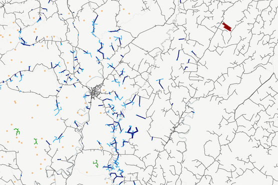 Black lines on a white background representing roads in a region in sub-Saharan Africa. Some of the short lines representing small roads are colored in either dark or light blue; a couple of lines are colored red or green. Orange dots also appear scattered mostly on the left side of the map.