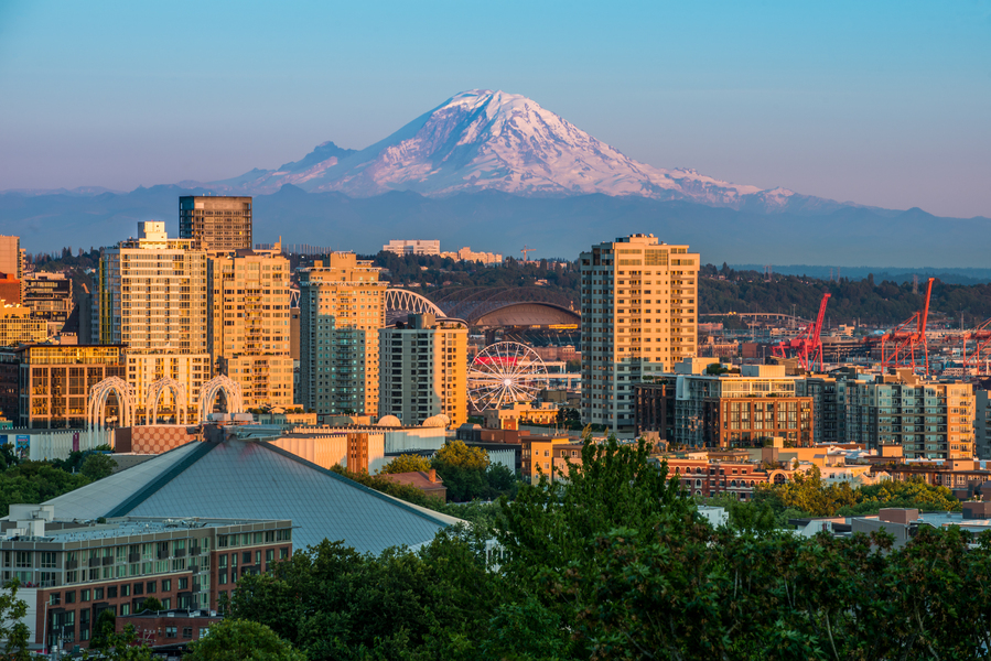 The Seattle skyline at dusk with Mount Rainier in the background.