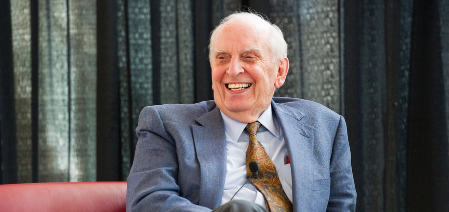 Headshot of William Pounds, seated and laughing