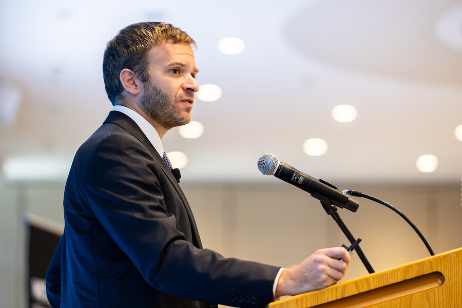 Jonah Wagner speaks at a lectern
