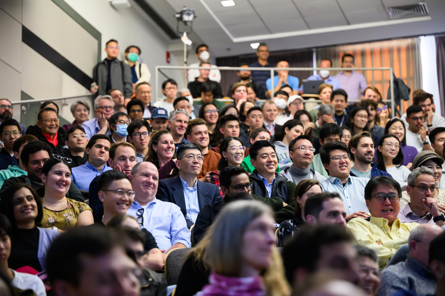 The captive audience laughs and smiles.