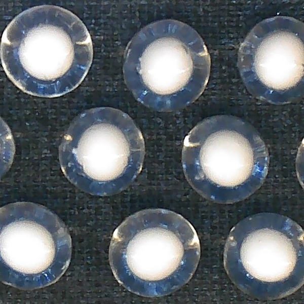 Three rows of clear spheres with smaller white spheres inside