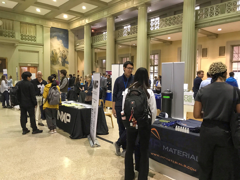 Recruiters and MIT students chat at a career fair on the MIT campus.