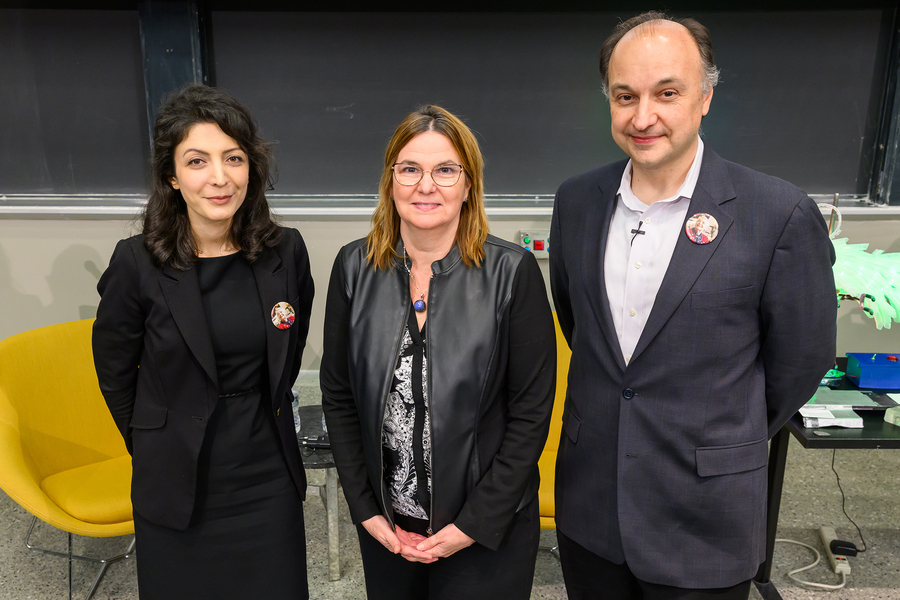 Farnaz Niroui, Angela Belcher, and Vladimir Bulović pose together at the front of a lecture hall