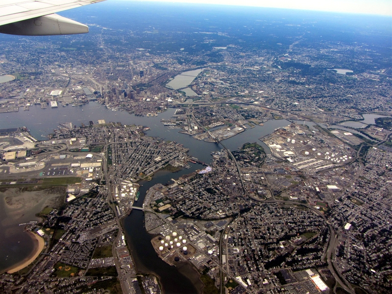 Aerial photo of Boston suburbs. East Boston and Logan Airport are in the foreground.