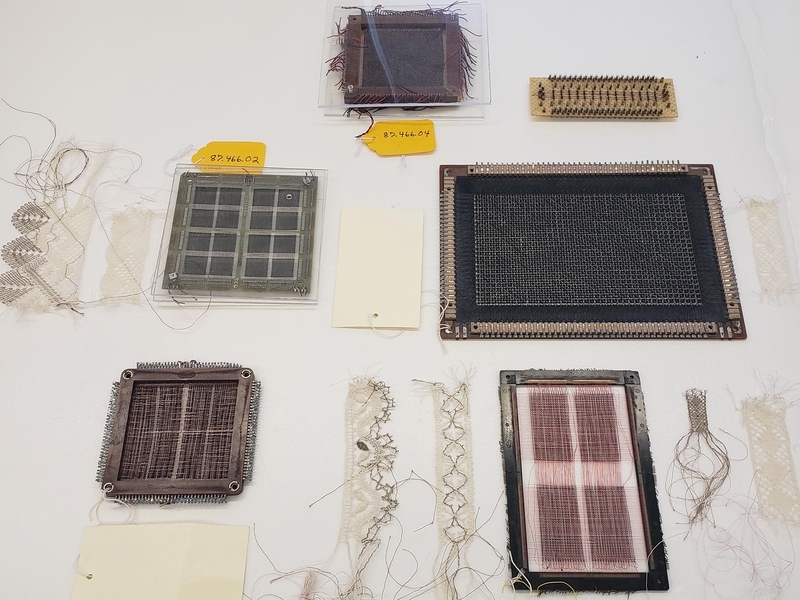 Magnetic, square, woven objects lying on a white background