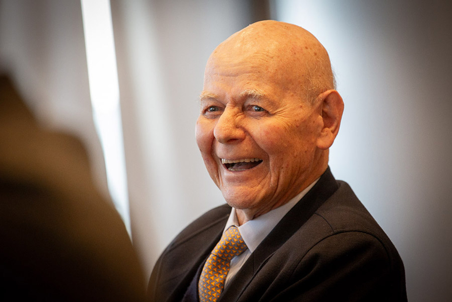 A close-up candid image of Carlos Prieto laughing