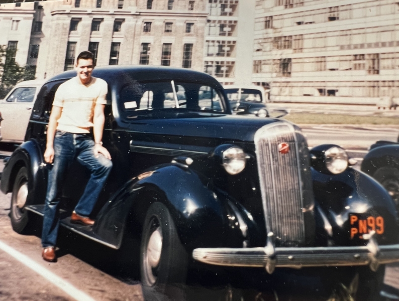 Professor Emeritus Bernhardt Wuensch as a young man, standing next to a car, on the MIT campus in the 1950s.