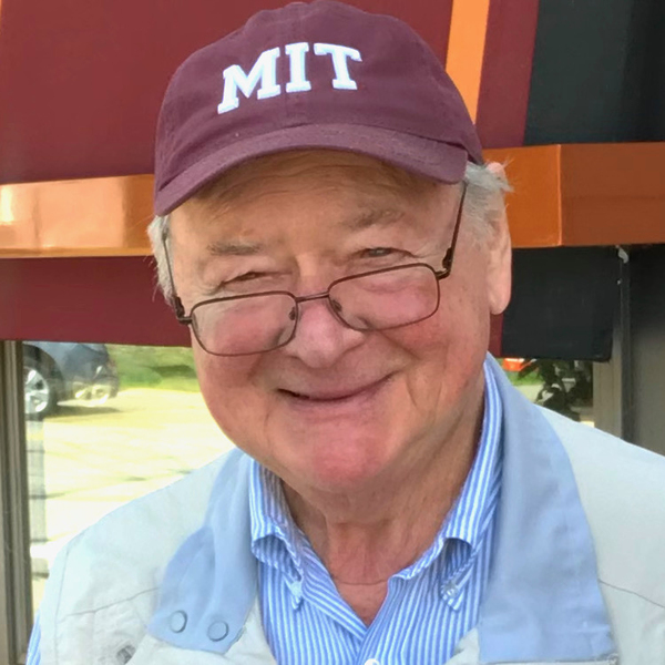 Headshot of Professor Emeritus Bernhardt Wuensch wearting a baseball cap reading "MIT"