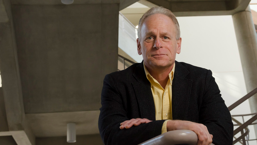 Portrait photo of John Fucillo posing on a indoor stairwell