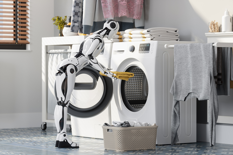 A robot putting laundry in a dryer