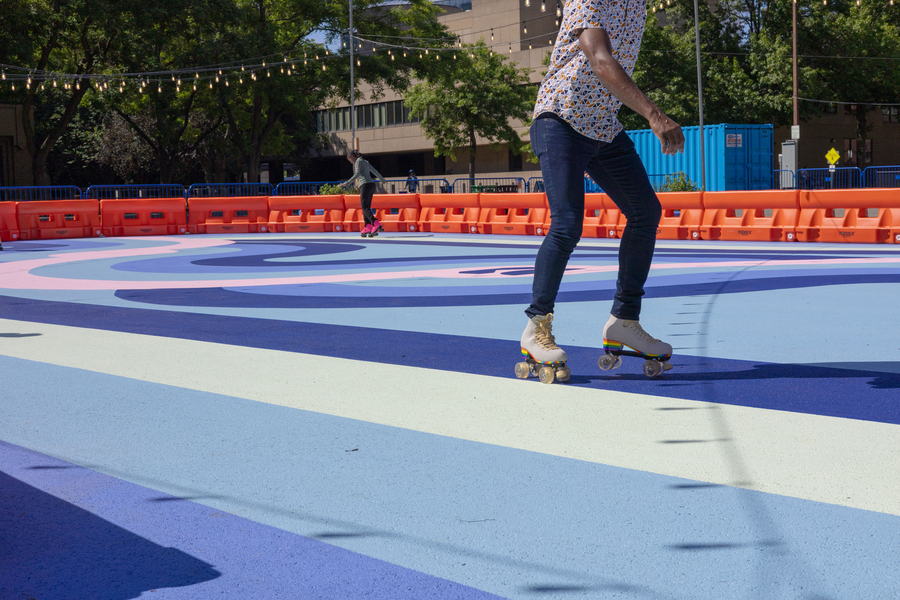 Person rollerskating on an outdoor rink