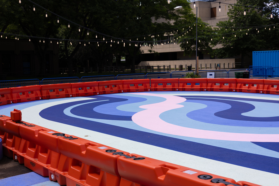 Outdoor roller rink with multicolored swirls painted on the floor
