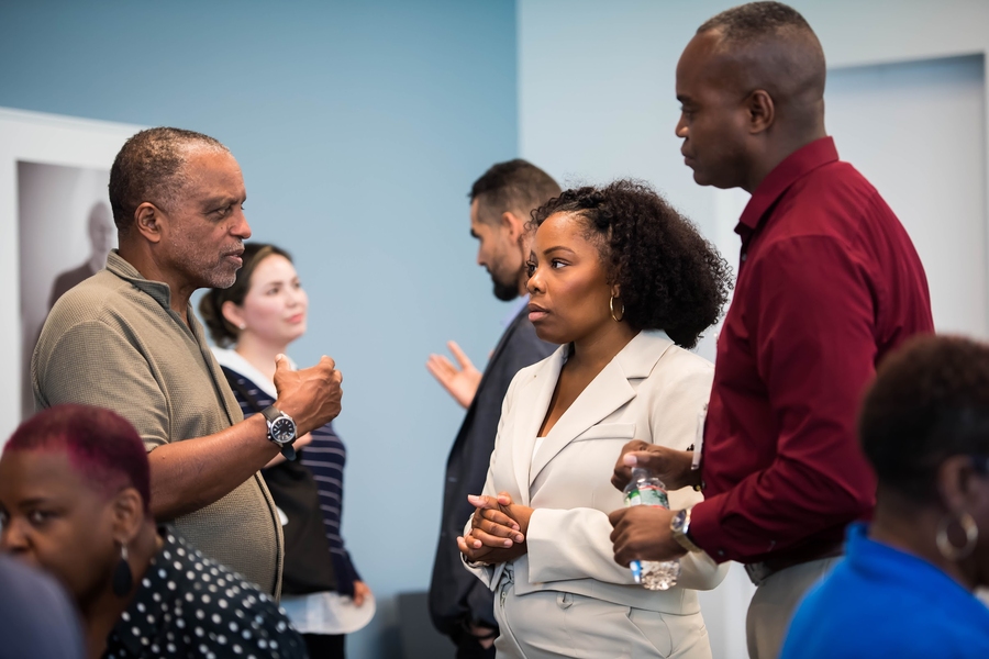 J. Phillip Thompson, Noelle Wakefield, Antonio Baines stand conversing
