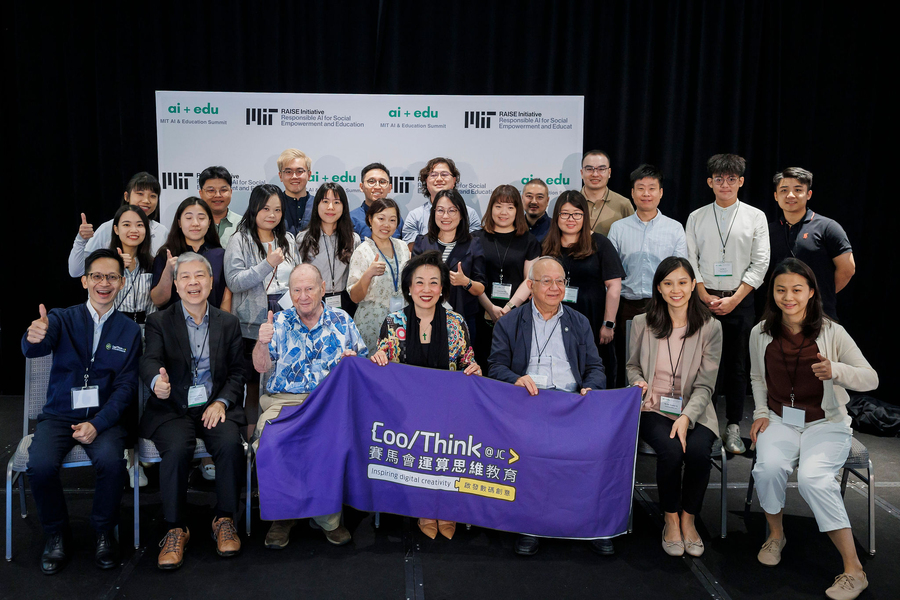 25 people in a group photo giving thumbs-up. At front row center, three people hold a banner with the CoolThink@JC logo