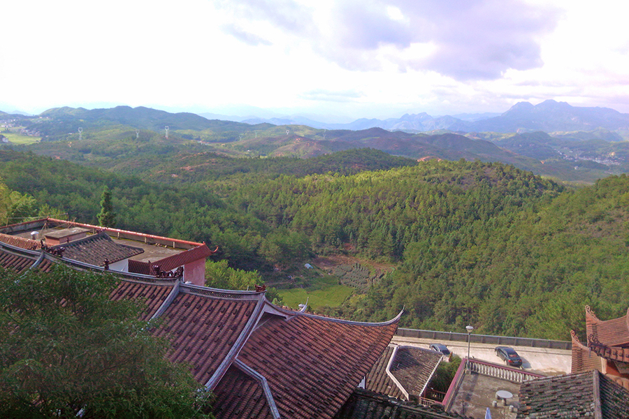 view of rooftops and landscape in China