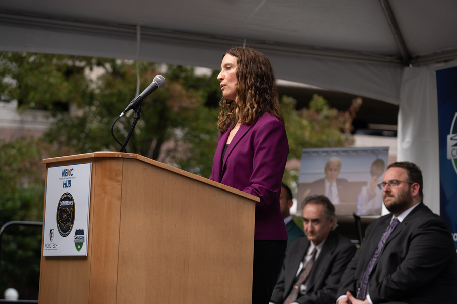 Melissa Choi speaks at a lectern
