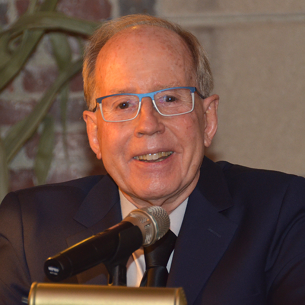 Closeup photo of Ronald Prinn at a lectern